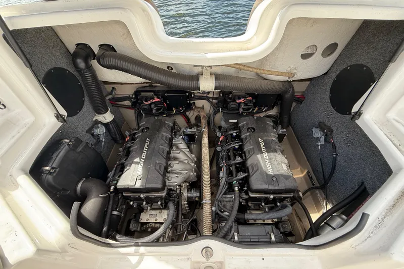 Slide: The Image of Engine compartment of 2014 Yamaha Boats 242 Limited S, showcasing dual high-output engines. - 49