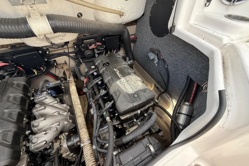 Slide: The Image of Engine compartment of a 2014 Yamaha Boats 242 Limited S, showcasing high-output engine components. - 50
