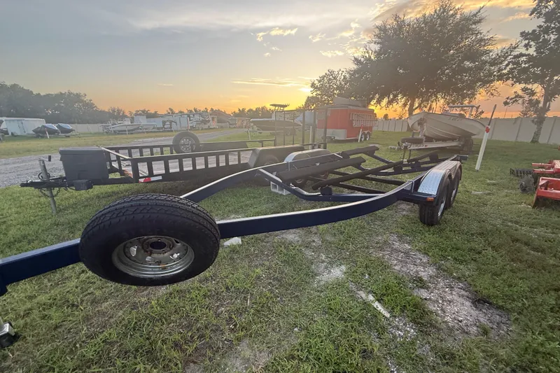 Slide: The Image of Trailer for 2014 Yamaha Boats 242 Limited S at sunset in grassy area. - 54