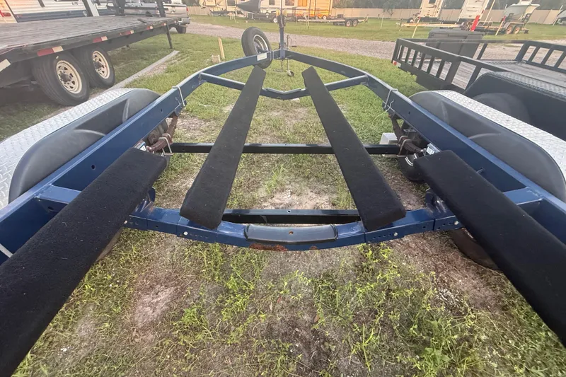 Slide: The Image of Trailer for 2014 Yamaha Boats 242 Limited S, parked on grass. - 58