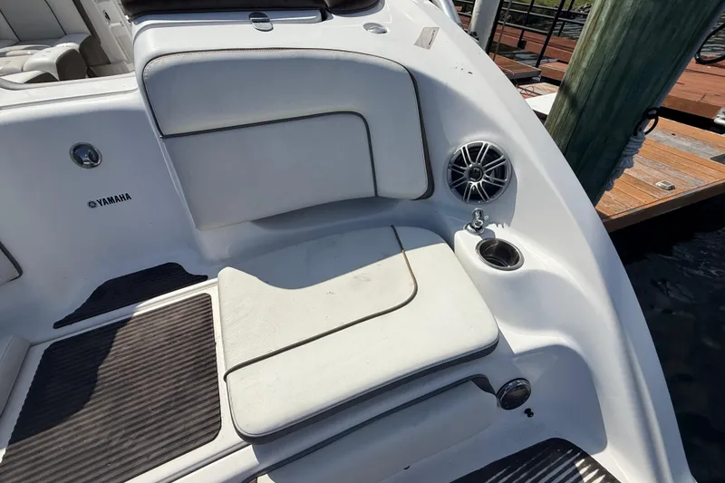 Slide: The Image of 2014 Yamaha Boats 242 Limited S interior with seating, speaker, and cup holder. - 9