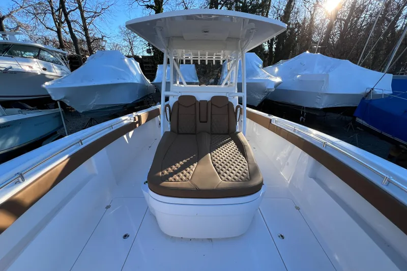 Slide: The Image of 2025 Invincible 33 Catamaran with cushioned seating and center console. - 7