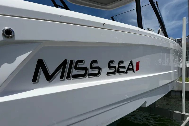 Slide: The Image of 2023 Axopar 25 Cross Top boat with "Miss Sea" name on the side. - 10