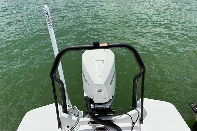 Slide: The Image of 2023 Axopar 25 Cross Top boat with Mercury engine on water. - 16