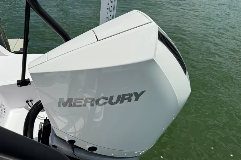 Slide: The Image of 2023 Axopar 25 Cross Top with Mercury engine on water. - 19