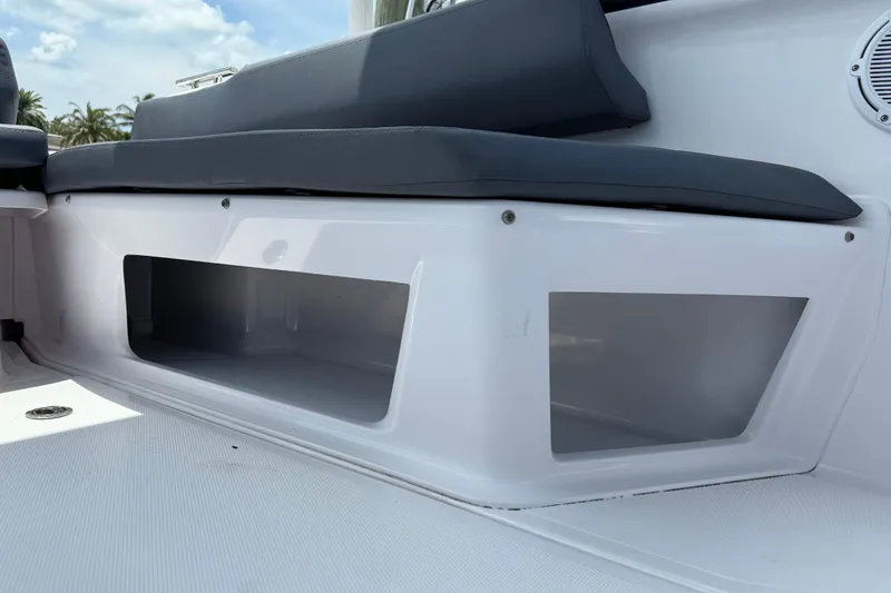 Slide: The Image of 2023 Axopar 25 Cross Top boat seating with storage compartments. - 24