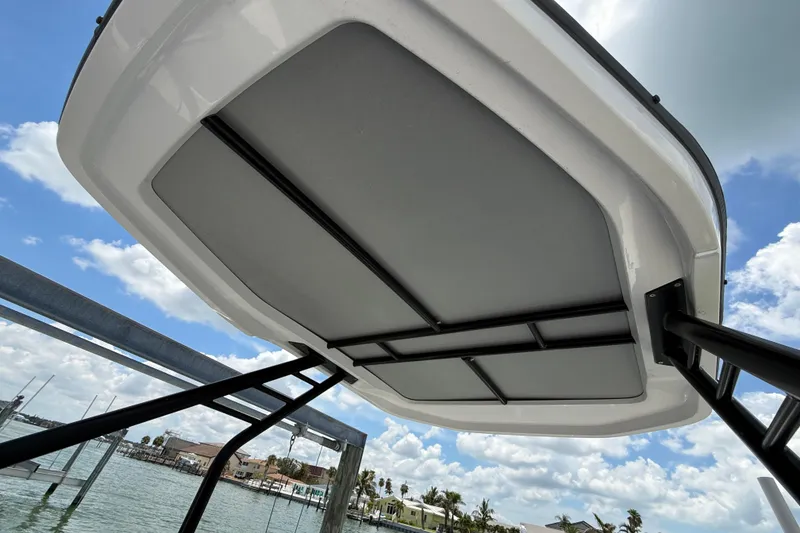 Slide: The Image of 2023 Axopar 25 Cross Top boat canopy against a blue sky. - 30