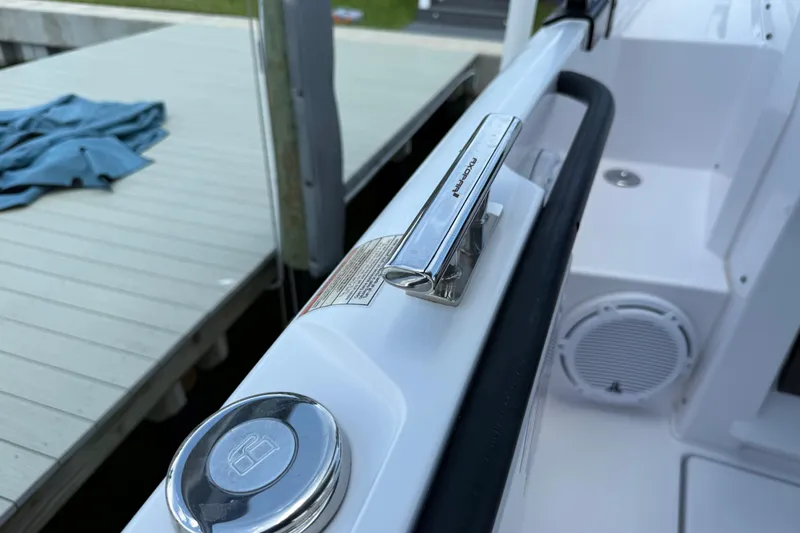 Slide: The Image of 2023 Axopar 25 Cross Top boat detail with cleat and speaker. - 32