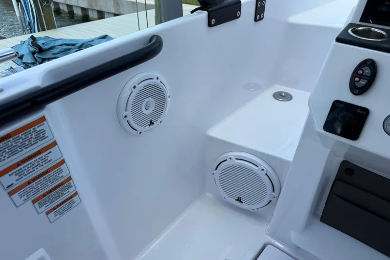 Slide: The Image of 2023 Axopar 25 Cross Top boat interior with speakers and control panel. - 33