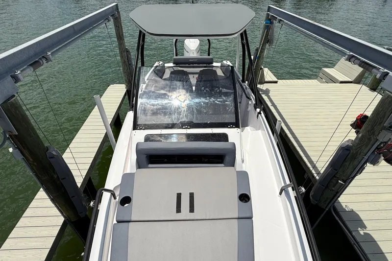 Slide: The Image of 2023 Axopar 25 Cross Top boat docked at marina, viewed from above. - 46
