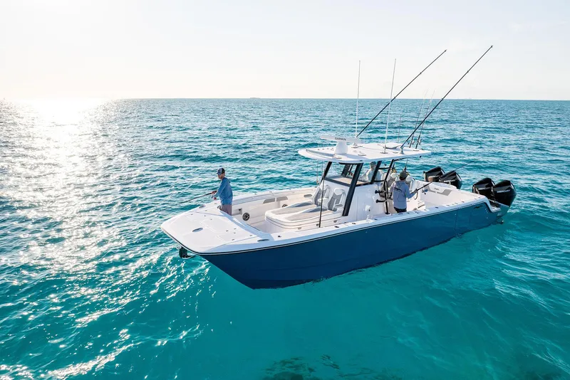 The Image of 2025 Invincible 36 Catamaran cruising on clear blue ocean waters. - 0