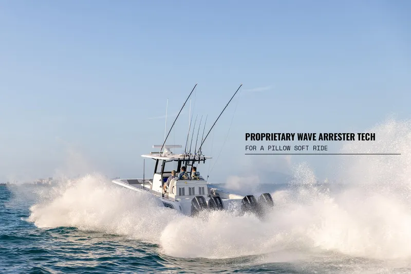 Slide: The Image of 2025 Invincible 36 Catamaran navigating waves with proprietary wave arrester technology for smooth ride. - 15