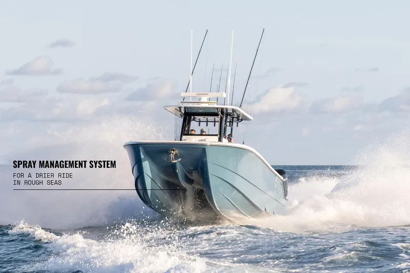 Slide: The Image of 2025 Invincible 36 Catamaran navigating rough seas with spray management system. - 19