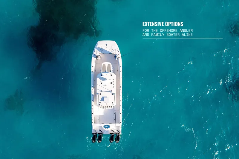 Slide: The Image of 2025 Invincible 36 Catamaran on clear blue water, ideal for anglers and family boating. - 16