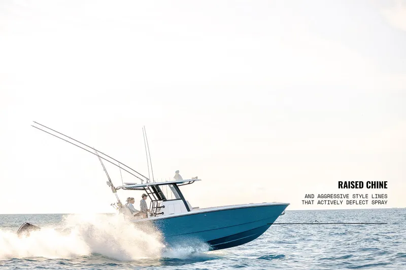 Slide: The Image of 2025 Invincible 36 Catamaran cruising on water, showcasing raised chine and sleek design. - 23