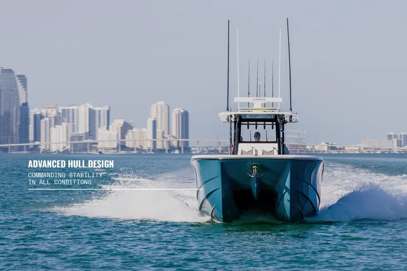 Slide: The Image of 2025 Invincible 36 Catamaran showcasing advanced hull design on open water. - 27
