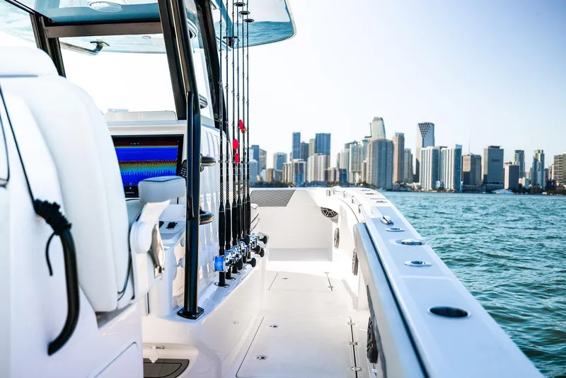 Slide: The Image of 2025 Invincible 36 Catamaran cruising near city skyline, showcasing luxury and performance. - 12
