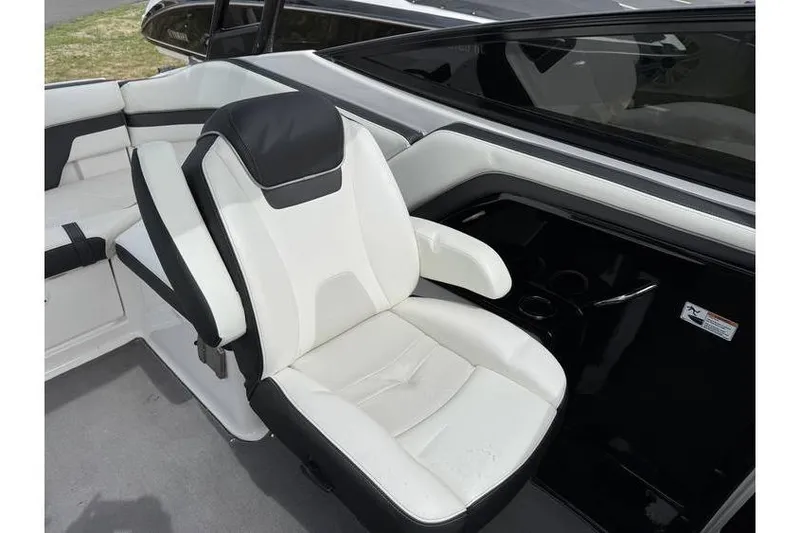 Slide: The Image of 2016 Yamaha AR240 boat interior with white and black seating. - 10