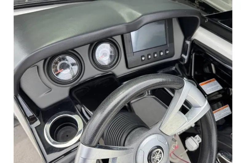 Slide: The Image of 2016 Yamaha AR240 dashboard with steering wheel, gauges, and display screen. - 4