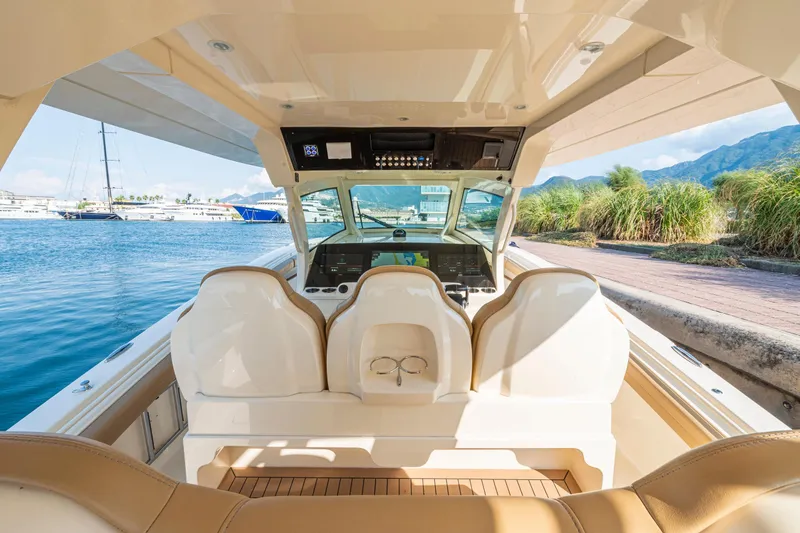 Slide: The Image of Interior view of 2023 Scout 425 LXF boat, featuring luxurious seating and advanced navigation system. - 10