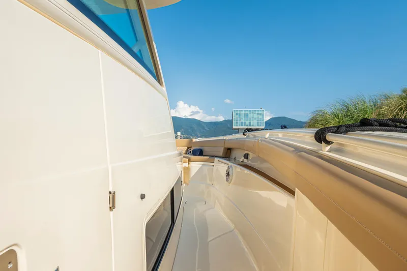 Slide: The Image of Luxurious interior of 2023 Scout 425 LXF boat with plush seating and modern controls. - 18