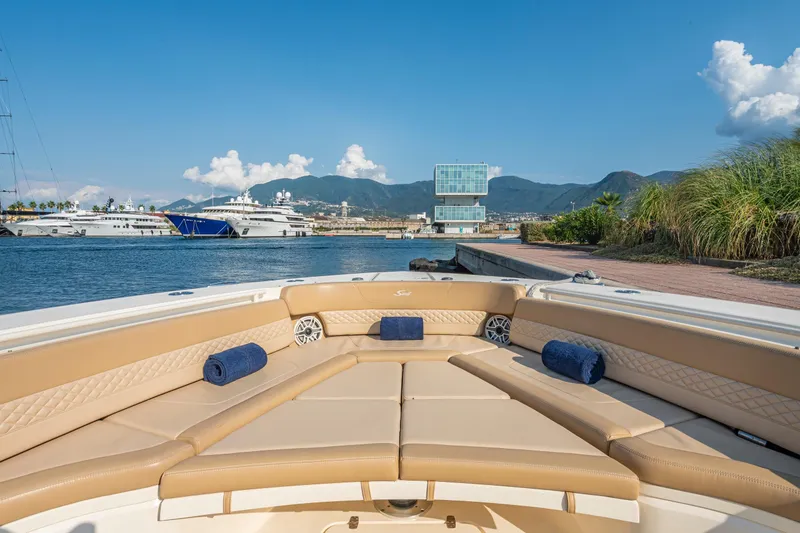 Slide: The Image of 2023 Scout 425 LXF boat deck with scenic mountain view. - 19
