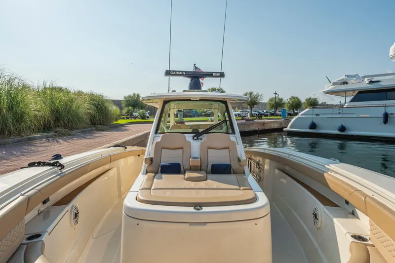 Slide: The Image of Luxurious beige leather seats in 2023 Scout 425 LXF boat, featuring elegant stitching. - 25
