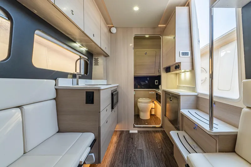 Slide: The Image of Luxurious interior of 2023 Scout 425 LXF boat with plush seating and modern design. - 31