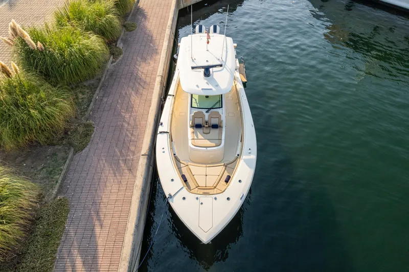 Slide: The Image of 2023 Scout 425 LXF boat docked with twin Mercury 600 V12 engines. - 4