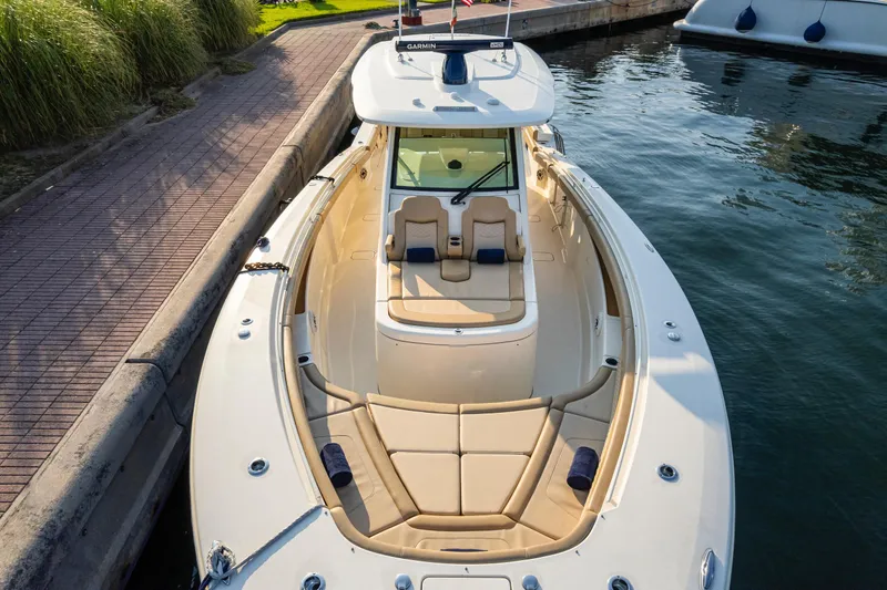 Slide: The Image of 2023 Scout 425 LXF boat interior with modern helm and luxurious seating. - 7