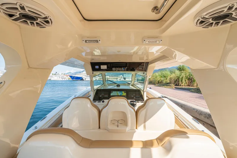 Slide: The Image of Luxurious interior of 2023 Scout 425 LXF boat with beige leather seating. - 9
