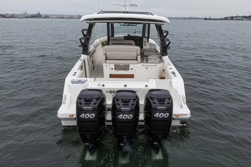 Slide: The Image of 2022 Boston Whaler 350 Realm with quad 400 Verado engines on water. - 18