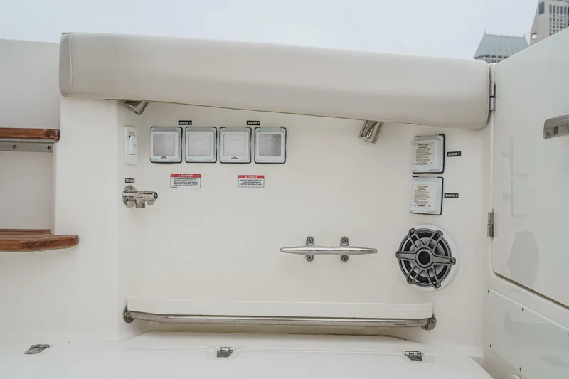 Slide: The Image of 2022 Boston Whaler 350 Realm boat interior with control panel and speaker. - 26