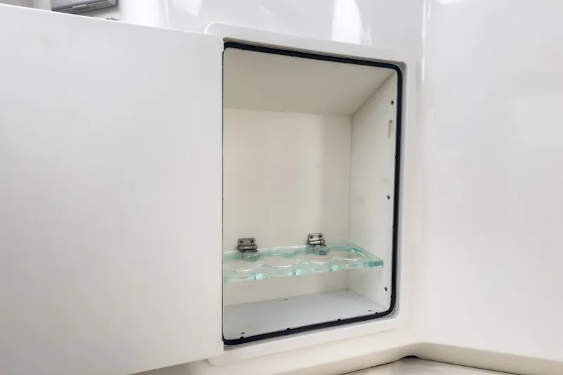 Slide: The Image of Open storage compartment on 2022 Boston Whaler 350 Realm boat. - 36