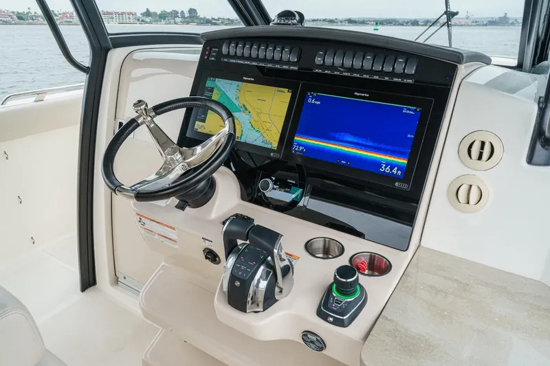 Slide: The Image of 2022 Boston Whaler 350 Realm helm with advanced navigation displays and controls. - 40