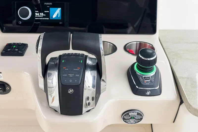 Slide: The Image of Control panel of a 2022 Boston Whaler 350 Realm boat with throttle and joystick. - 43