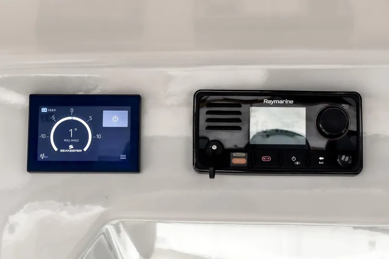 Slide: The Image of Control panel of 2022 Boston Whaler 350 Realm with Seakeeper and Raymarine displays. - 45