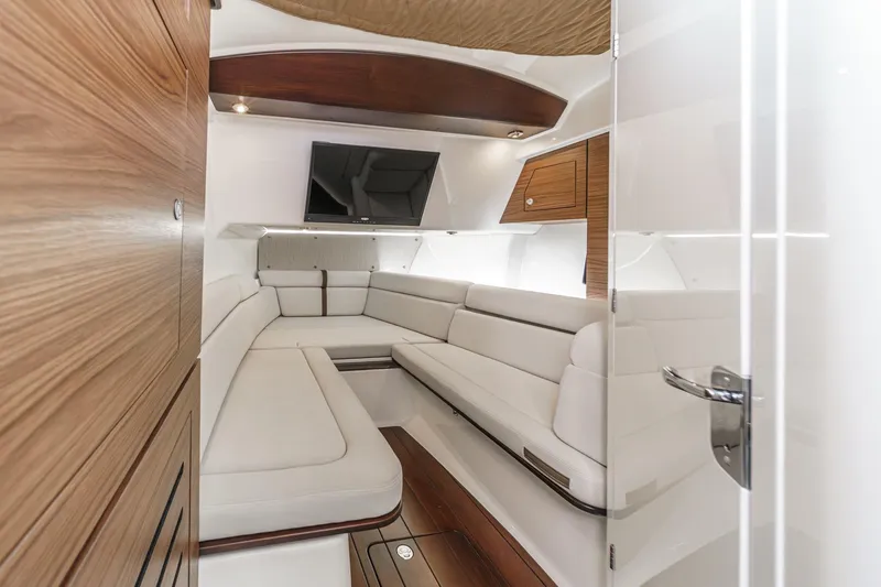 Slide: The Image of Luxurious interior of 2022 Boston Whaler 350 Realm with plush seating and modern design. - 58