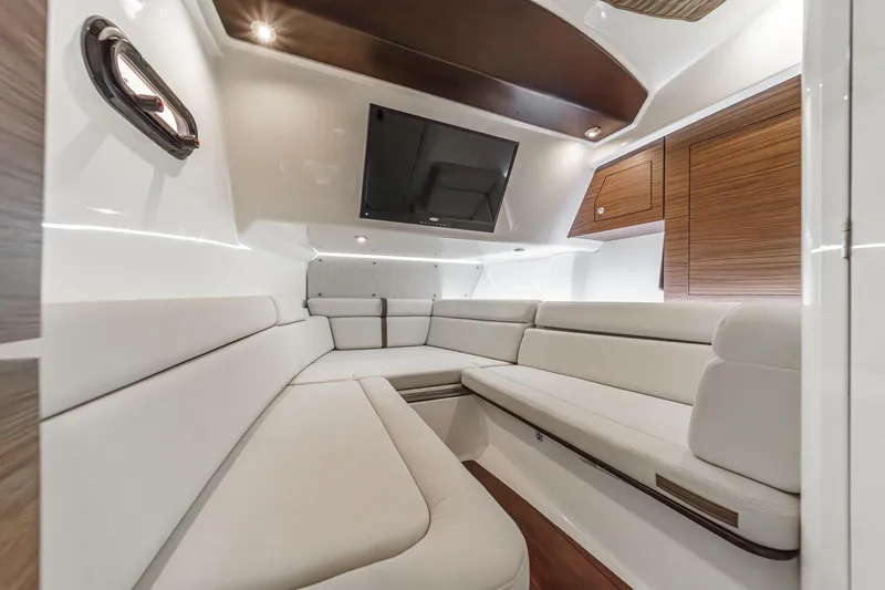 Slide: The Image of Luxurious interior of 2022 Boston Whaler 350 Realm boat with plush seating and modern design. - 59