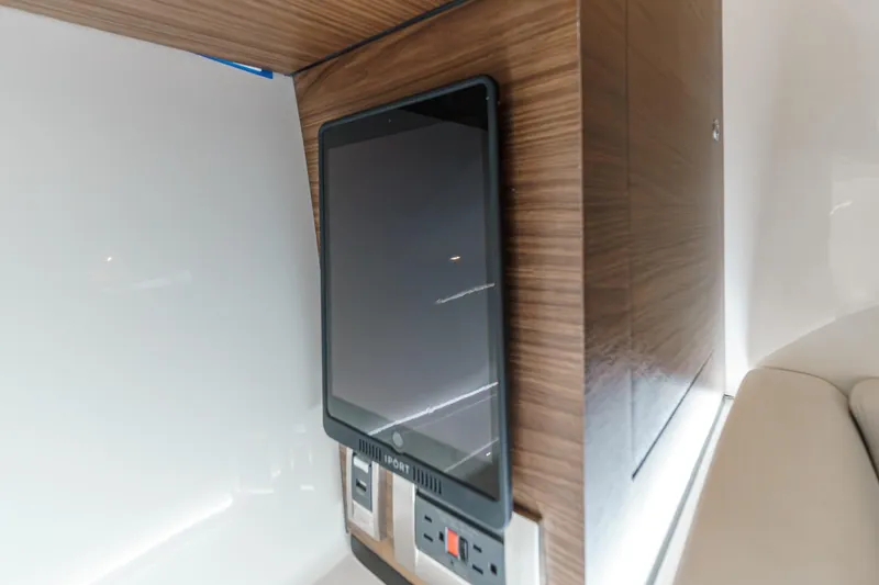Slide: The Image of Control panel and outlets on 2022 Boston Whaler 350 Realm boat interior. - 62