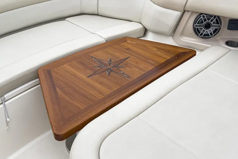 Slide: The Image of Luxurious interior of 2022 Boston Whaler 350 Realm with elegant wooden table. - 71