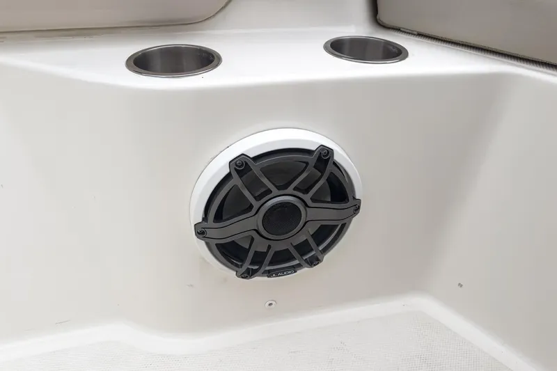 Slide: The Image of Speaker and cup holders on 2022 Boston Whaler 350 Realm boat interior. - 75