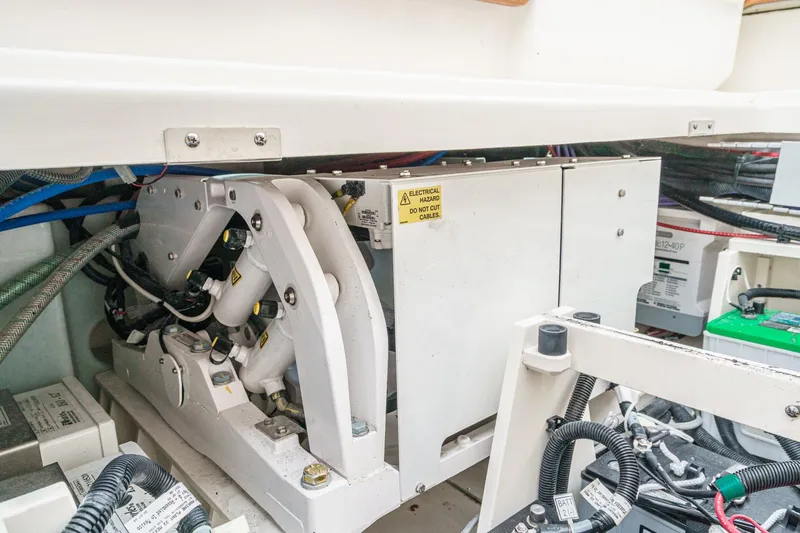 Slide: The Image of Engine compartment of 2022 Boston Whaler 350 Realm, showcasing electrical components and wiring. - 89