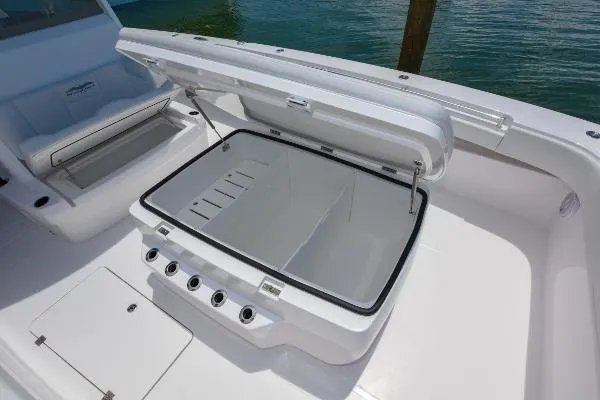 Slide: The Image of Open storage compartment on 2025 Invincible 38 Catamaran, showcasing spacious design. - 21