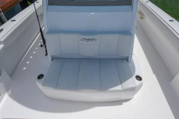 Slide: The Image of Invincible 38 Catamaran 2025, featuring a sleek seating area with integrated cup holders. - 26