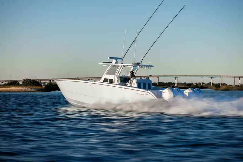 Slide: The Image of 2025 Invincible 38 Catamaran speeding on water, showcasing sleek design and powerful engines. - 8