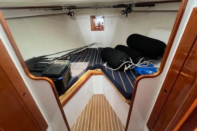 Slide: The Image of 2007 Northern Bay Hardtop Cruiser cabin with fishing gear and storage. - 11
