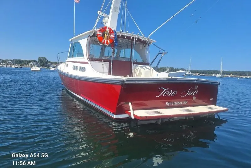 Slide: The Image of Red 2007 Northern Bay Hardtop Cruiser/Fishing Vessel on calm water, Rye Harbor, NH. - 2