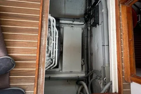 Slide: The Image of 2007 Northern Bay Hardtop Cruiser engine room with visible piping and equipment. - 22