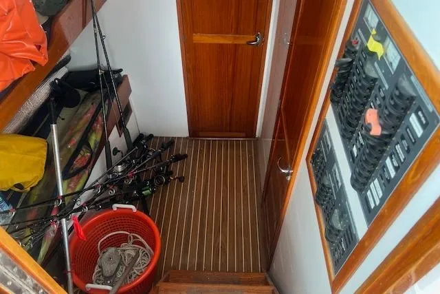 Slide: The Image of 2007 Northern Bay Hardtop Cruiser interior with fishing gear and control panel. - 23